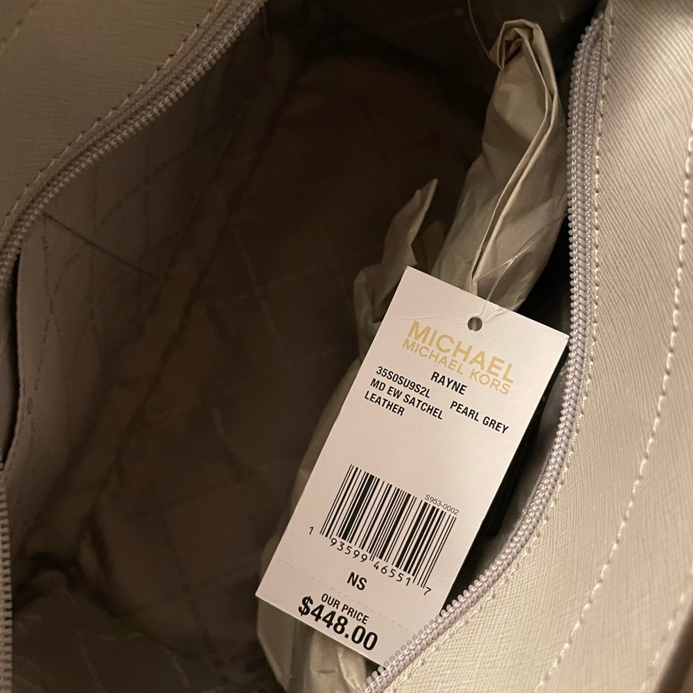 Medium hand bag. Color is grey. Brand New!!!